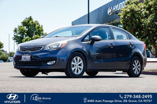 2015 Kia Rio EX in Platinum Graphite — front three-quarter view