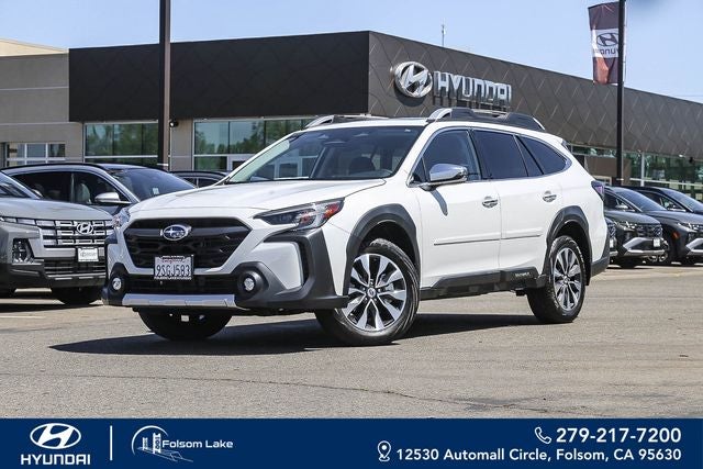 2025 Subaru Outback Touring XT in Crystal White Pearl — front three-quarter view