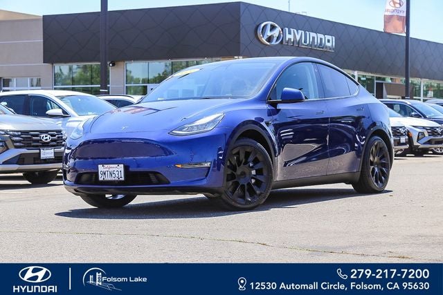 2021 Tesla Model Y Long Range in Deep Blue Metallic — front three-quarter view