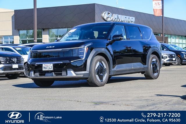 2024 Kia EV9 Light Long Range in Aurora Black Pearl — front three-quarter view
